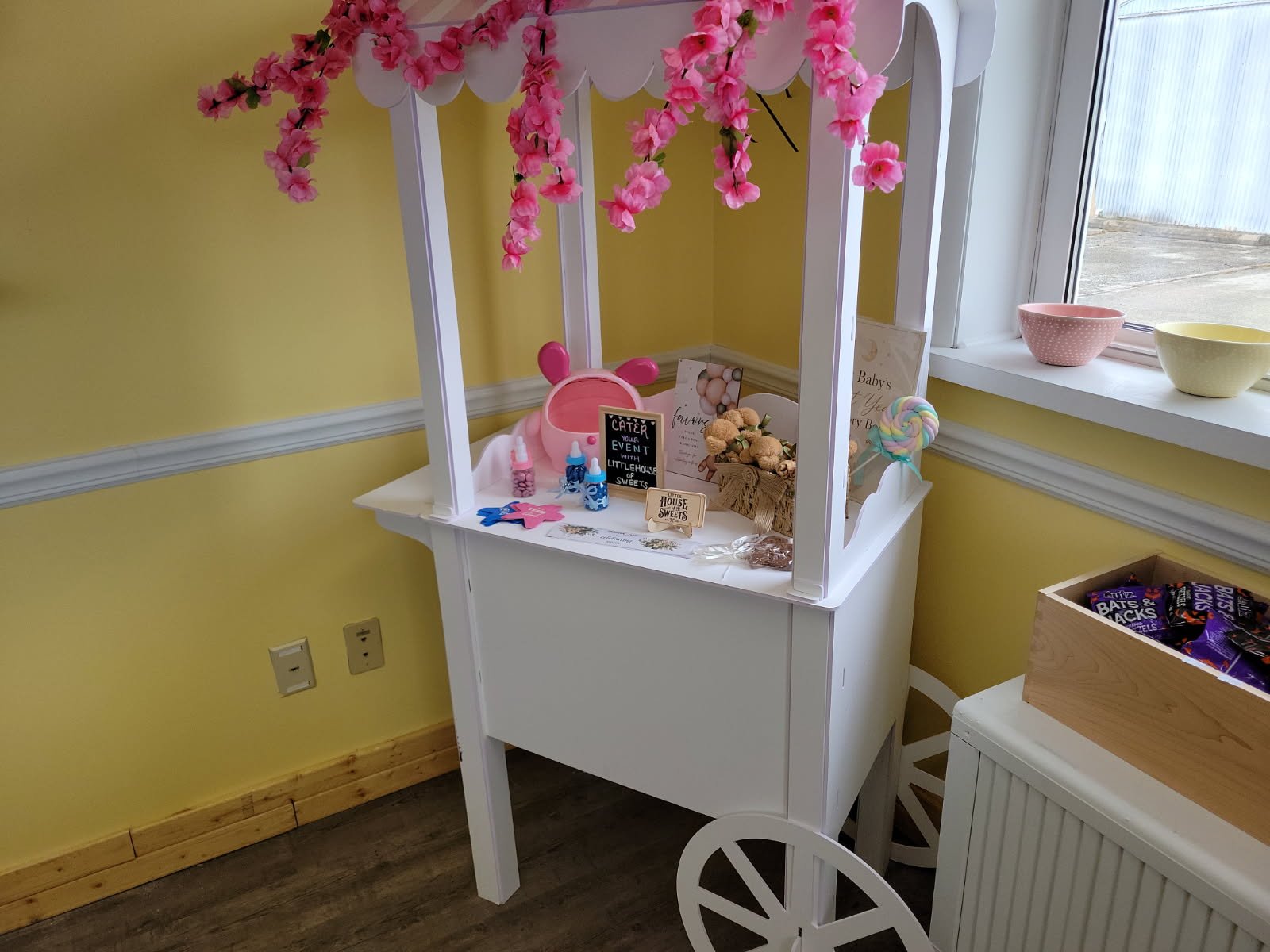 Candy cart with pink flowers